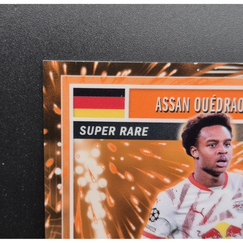 2025 Topps Merlin Collection Assan Ouedraogo #MG-37 Super Rare Orange /25 (RC)